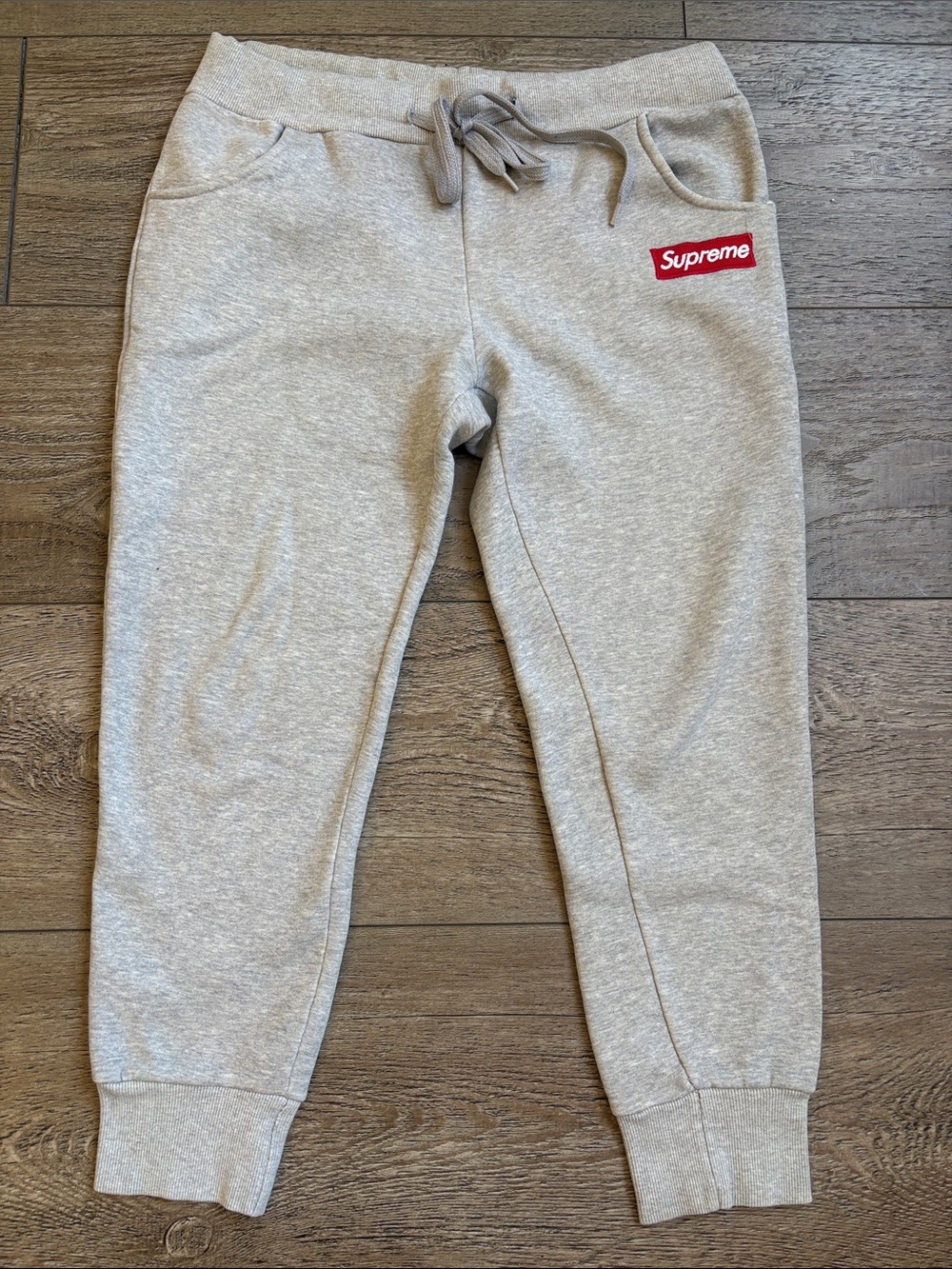 Supreme Kids Light Grey Sweatpant Joggers with Red Logo Patch
